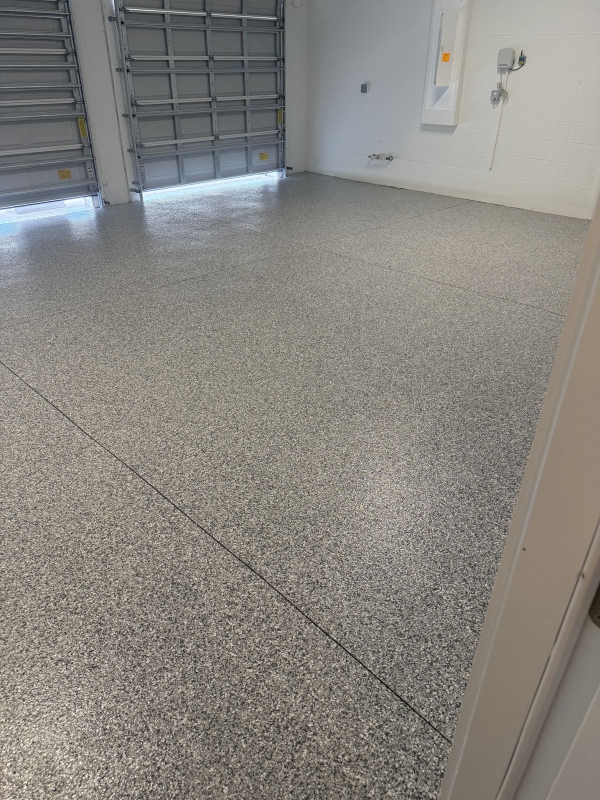 Flake floor coating in a double door commercial workshop