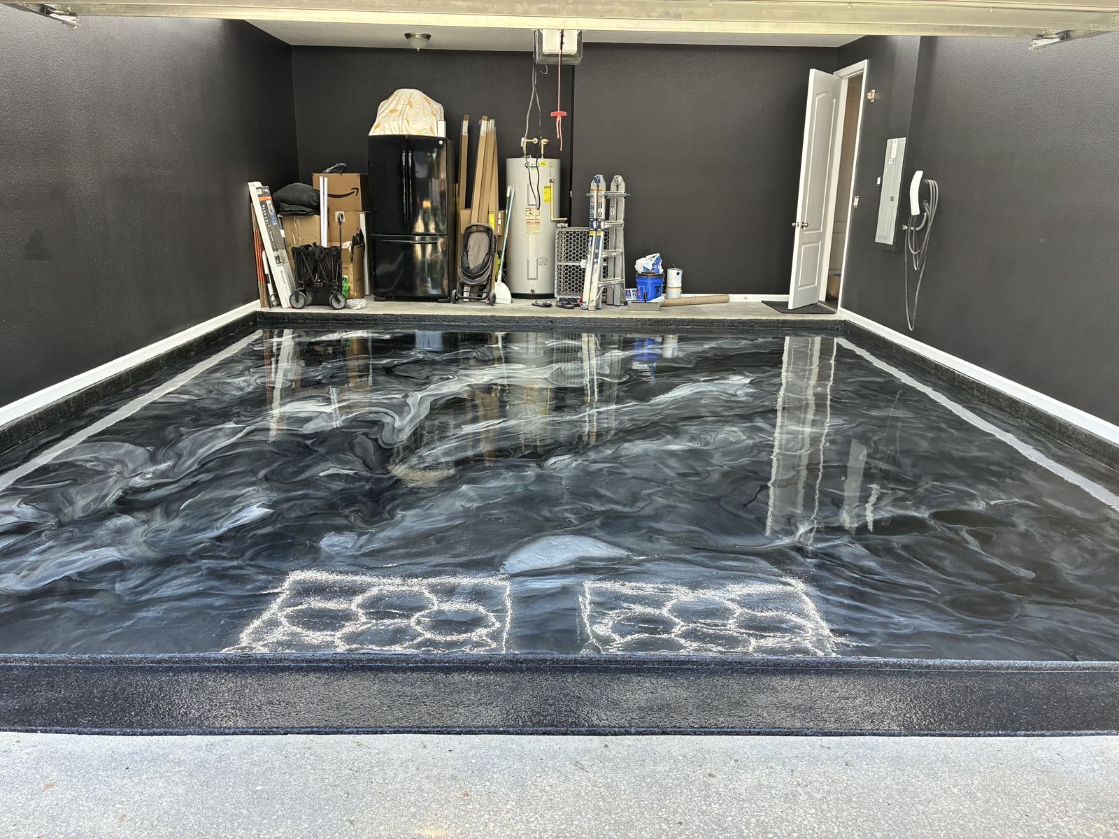 Finished silver and black metallic garage floor with border stripes