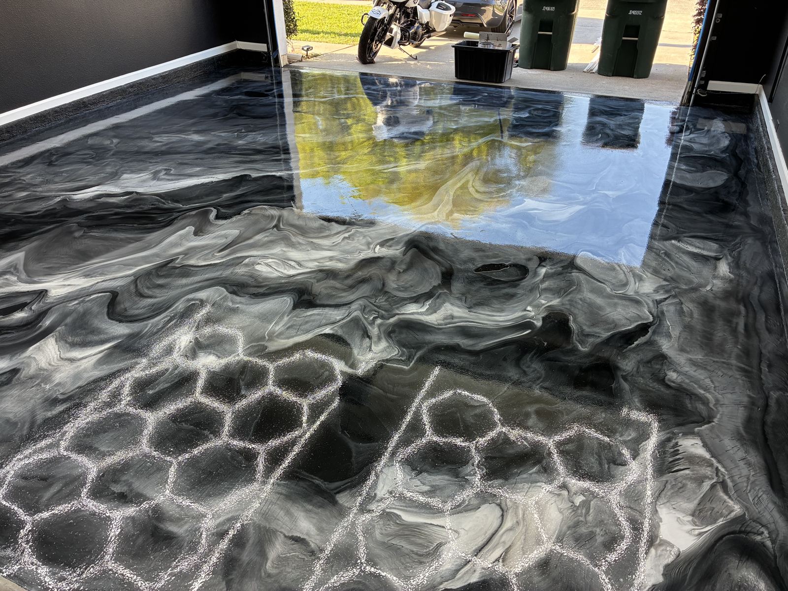 Silver and black metallic garage floor mid installation